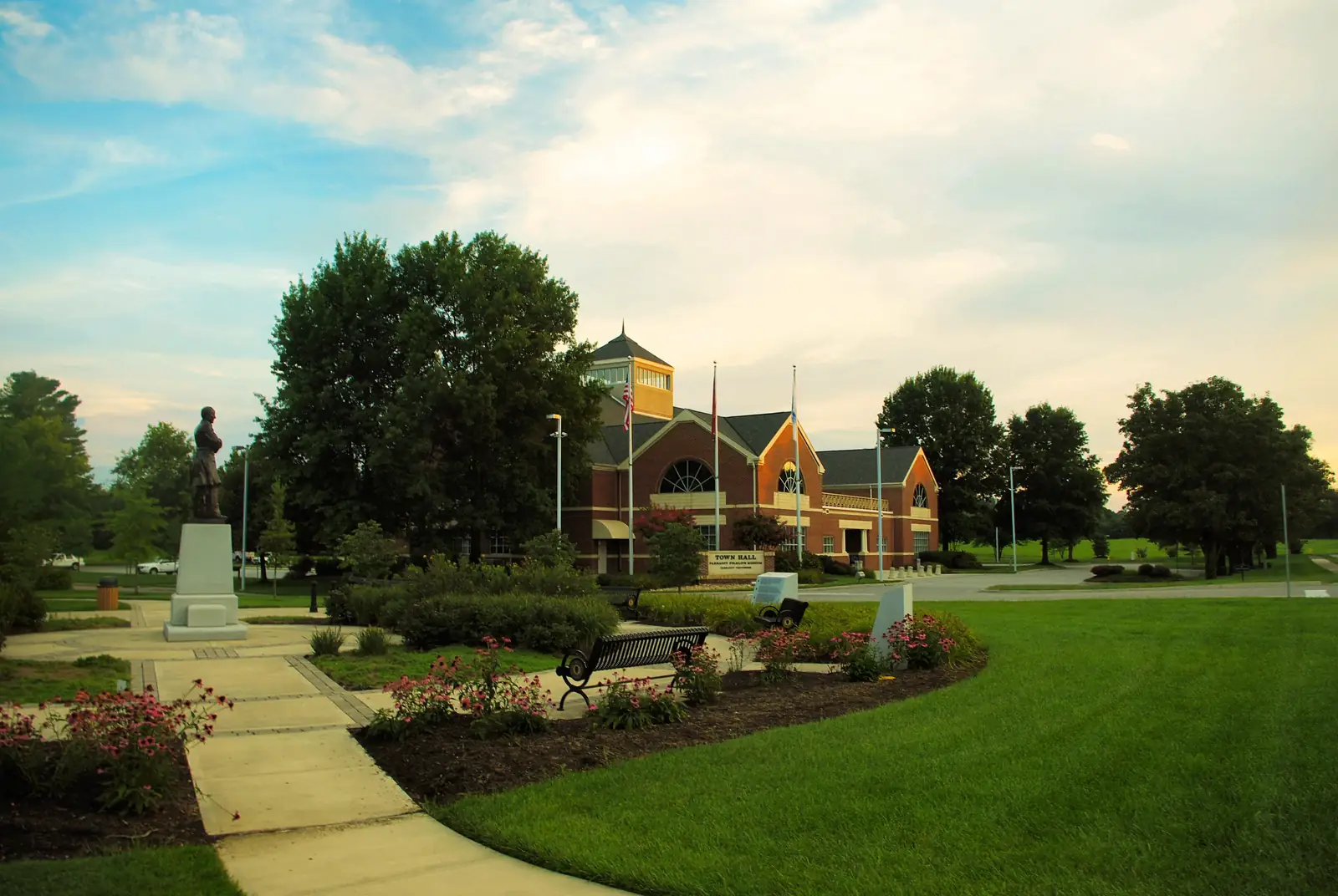 Farragut Town Hall, a brick building with a green lawn and trees in front