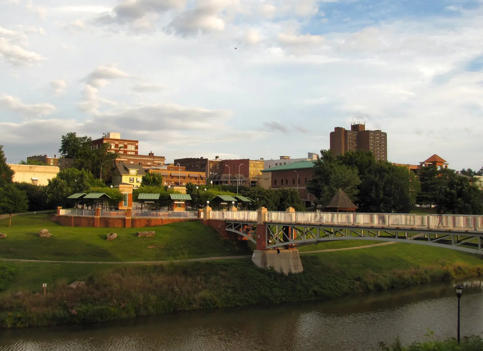 Downtown Maryville buildings beyond the Pistol Creek greenway in late-day light